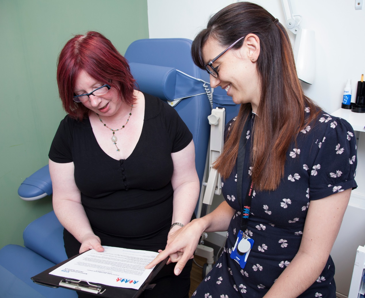 BioResource participant Georgina discusses form with staff member
